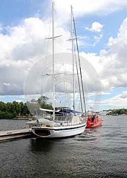 Sail boat moored at Strandvagen embankment of Stockholm Harbor, Sweden