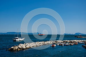 Sail boat on mountains background on the gulf of Naples in Italy.