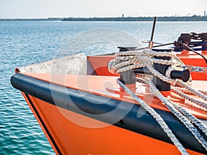 Sail boat rope tied to a bitt mooring bollard