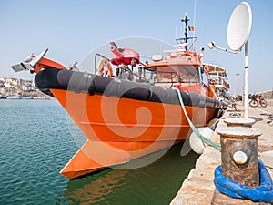 Sail boat rope tied to a bitt mooring bollard. Sail bot anchored in Tomis Touristic Port, Constanta Romania