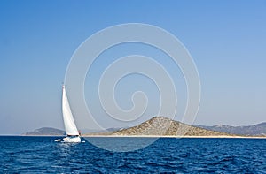 Sail boat sailing near island, Croatia