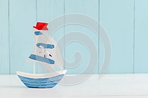 Sail boat Toy model with Seagull - Nautical background