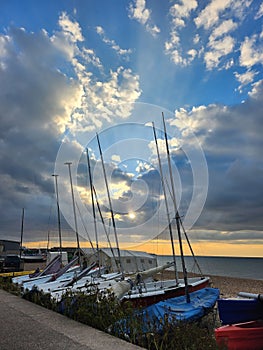 Sail boats along whitstable sea front