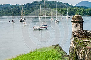 Sail boats and Fuerte Santiago fortress in Portobelo village, Pana