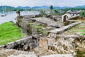 Sail boats and Fuerte Santiago fortress in Portobelo village, Pana