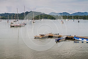 Sail boats and a pier in Portobelo village, Pana