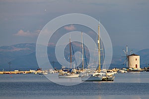 Sail-boats and WIndmill, seafront of Corfu city, Corfu, Greece