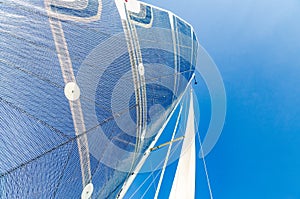 Sail of a Catamaran sailing boat against clear blue sky