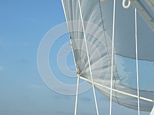 Sail full of wind while sailing with blue sky
