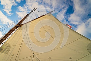 the sail on a historic  gaff-rigged `Friendship` sloop