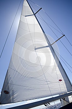 Sail yacht on the background of blue sky
