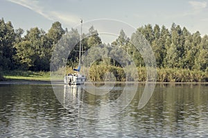 Sailboar at anchor in a bay