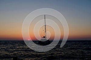 Sailboat in the Aegean Sea at Sunset