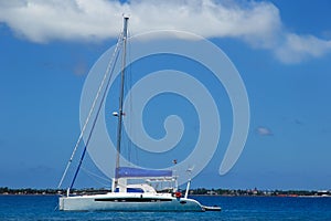 Sailboat anchired near Pangaimotu island in Tonga photo