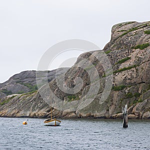 Sailboat at anchor on archipelago coast