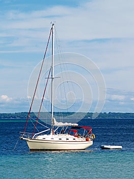 Sailboat anchored in harbor