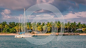 Sailboat anchors off Peanut Island in the tranquil waters of Palm Beach inlet