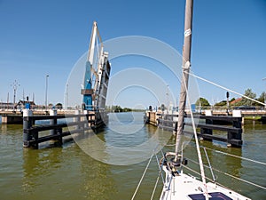 Sailboat approaching bridge - 4 4, Warnsebrug over Johan Frisokanaal, Friesland, Netherlands photo