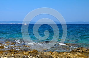 Sailboat on the background of the Adriatic Sea Coast of the island of Rab