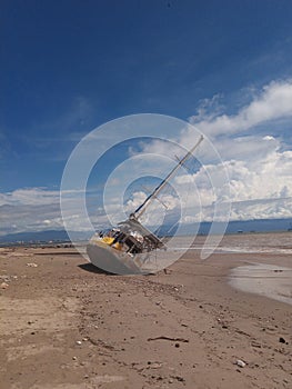 Sailboat on beach after hurricane