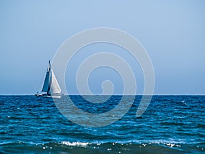 Sailboat on blue sea photo