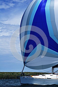 Sailboat with Blue Spinnaker Sail