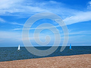 Sailboat blue and white with sky blue sea