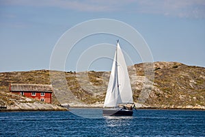 Sailboat in cliff archipelago