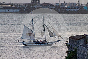 Sailboat cruising through Old San Juan Bay