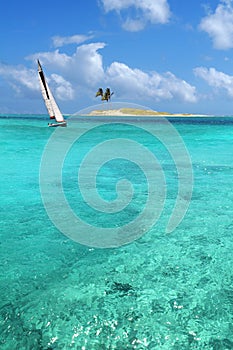 Sailboat In Crystal Clear Waters