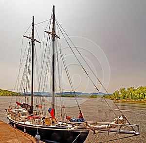 sailboat docked at Hudson New York on Hudson River with Catskill Mountains