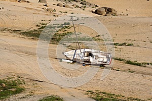 Sailboat on dry lake bed
