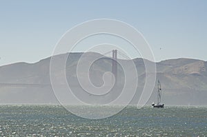 Sailboat in front of Golden Gate Bridge