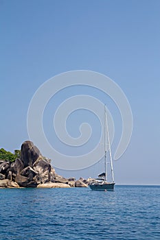 Sailboat and giant rock