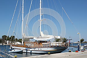 Sailboat in harbor summer scene