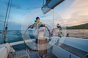 Sailboat helmsman at his watch photo