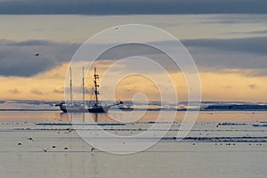 Sailboat in the ice of the Arctic