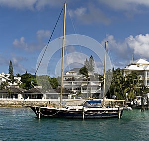 Sailboat infront of luxury home