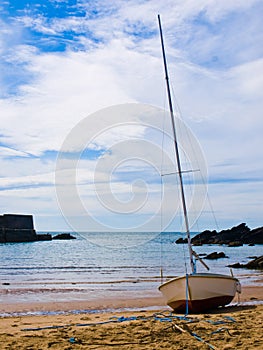 Sailboat on inlet beach