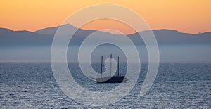 Sailboat in the Ionian Sea with Mountain Landscape Background. Katakolo, Greece.
