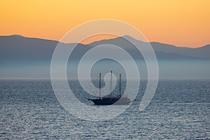 Sailboat in the Ionian Sea with Mountain Landscape Background. Katakolo, Greece.