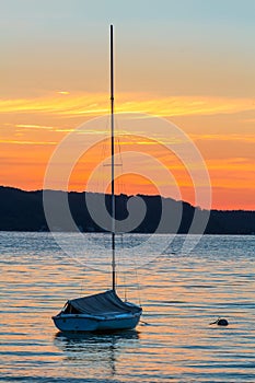 Sailboat on Lake at Daybreak