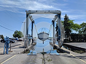 Sailboat launch Detroit boat marina sunny clouds trees green