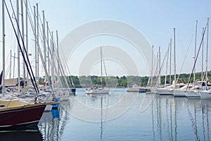 Sailboat leaving harbor, Yachts and boats parked in harbor, sunrise, morning