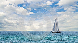 Sailboat on light blue water off Florida Gulf