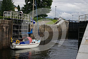 A sailboat through a loch