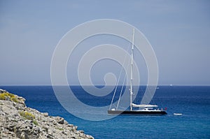 Sailboat moored in the calm and crystal clear waters. Majorca, Balearic Islands, Spain. Europe