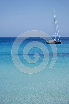 Sailboat moored in the calm and crystal clear waters. Majorca, Balearic Islands, Spain. Europe