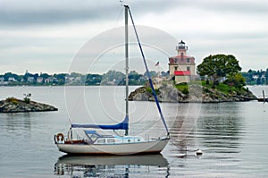 Sailboat Moored Near Lighthouse in Providence Rhode Island