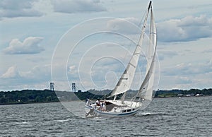 Sailboat in Narragansett Bay with Mt. Hope Bridge in Background photo
